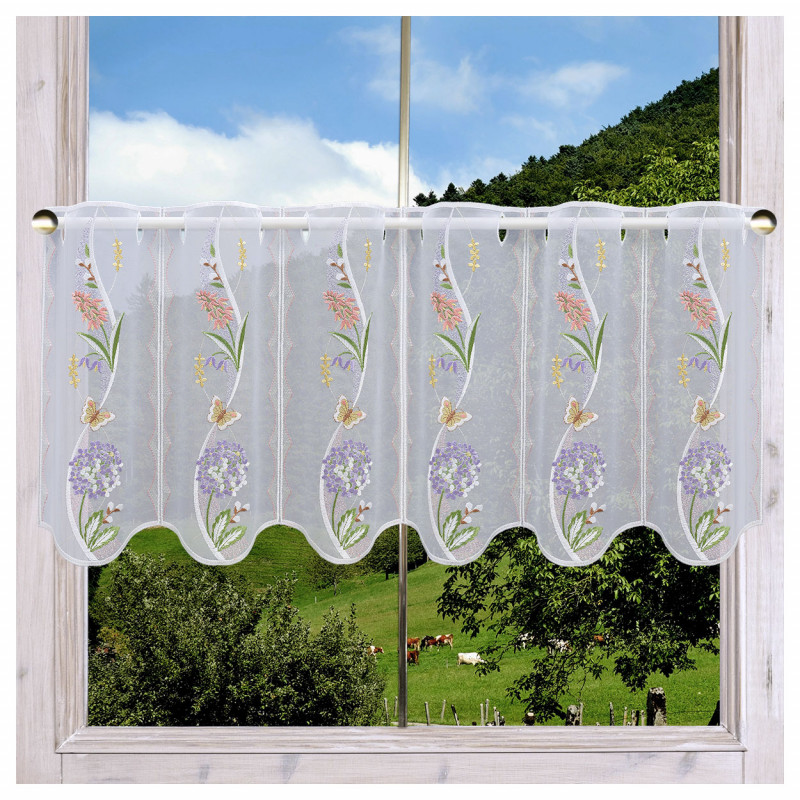 Scheibenhänger Florina mit Blütenmotiv am Fenster