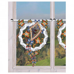 Scheibenhänger Fröhlicher Drachen im Herbstwind dekoriert am Fenster