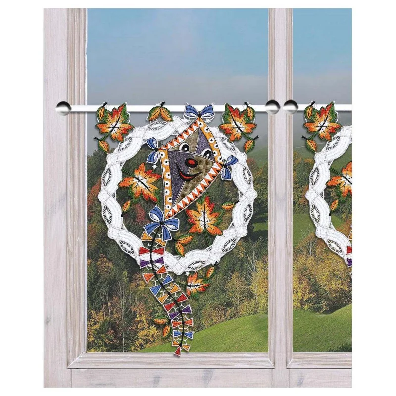 Scheibenhänger Fröhlicher Drachen im Herbstwind dekoriert am Fenster