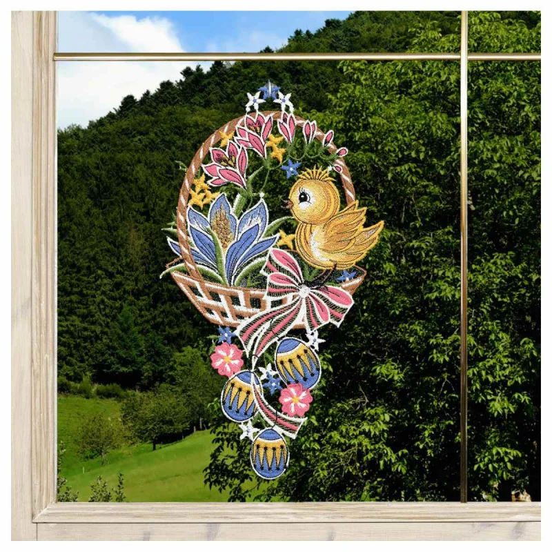 Fensterbild Küken im Osterkorb in blau am Fenster