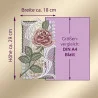 Eine digitale Illustration zeigt eine gestickte Rose mit grünen Blättern auf weißer Spitze. Die Stickerei ist neben einem lilafarbenen DIN-A4-Blatt (29 cm x 18 cm) abgebildet, das mit Pfeilen und deutschem Text beschriftet ist, um die Größe zu ermitteln.