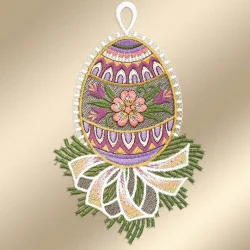 Fensterdeko Osterei mit Primel vor einem goldenen Hintergrund